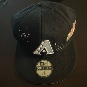 Black Diamond backs baseball cap with pink flowers stitched on